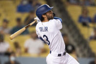 Los Angeles Dodgers' Chris Taylor watches his solo home run during the fifth inning of a baseball game against the Philadelphia Phillies in Los Angeles, Monday, June 14, 2021. (AP Photo/Kyusung Gong)