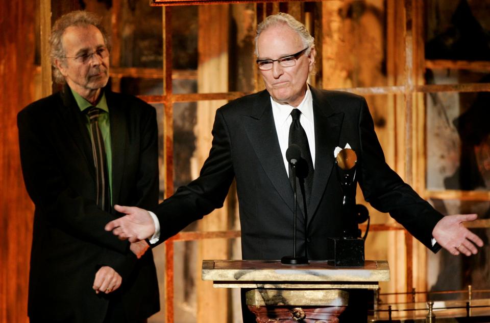 Jerry Moss, right, and Herb Alpert, co-founders of A&M Records, appear during their induction into the Rock & Roll Hall of Fame in New York on March 13, 2006.