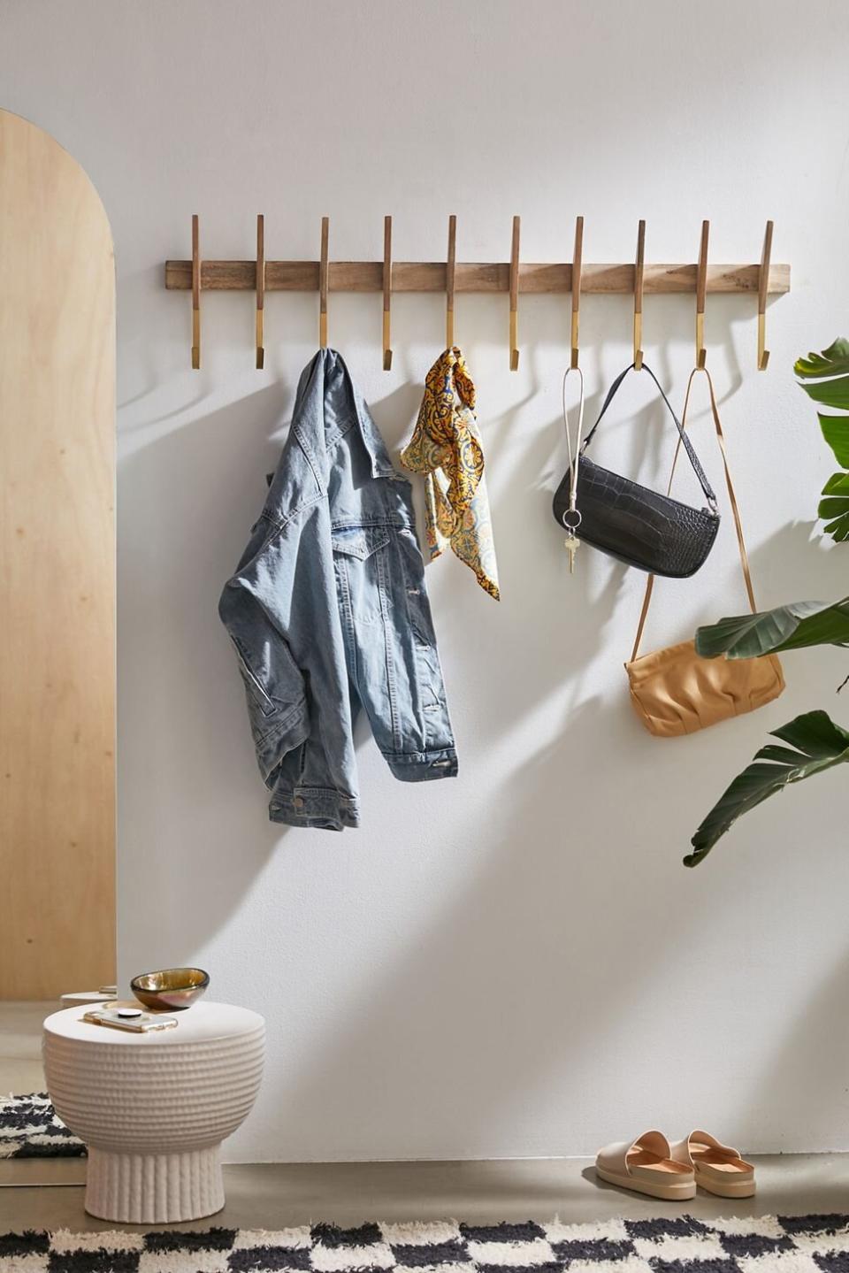 Small Entryway Wooden Wall Hooks holding coats and scarf