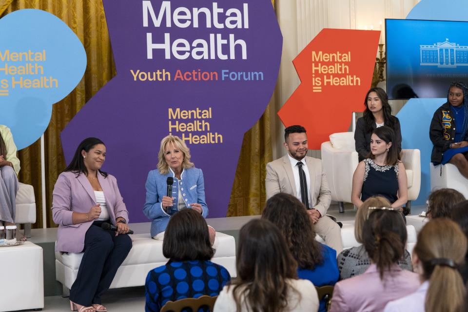 First lady Jill Biden speaks with, from left, youth mental health leader Ayanna Kelly, youth mental health leader Juan Acosta, and actress and mental health advocate Selena Gomez, during the White House Conversation on Youth Mental Health, Wednesday, May 18, 2022, at the White House in Washington. (AP Photo/Jacquelyn Martin)