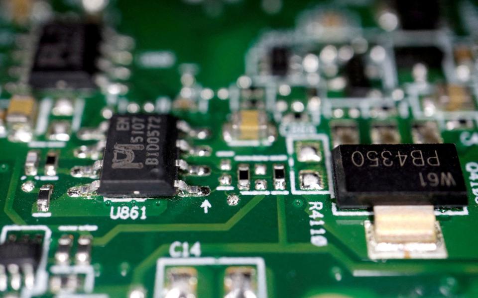 Semiconductor chips are seen on a printed circuit board