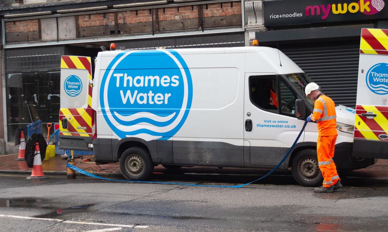 <span>Thames Water employees repairing a burst pipe in Reading Town Centre in Berkshire. </span><span>Photograph: Maureen McLean/Rex/Shutterstock</span>