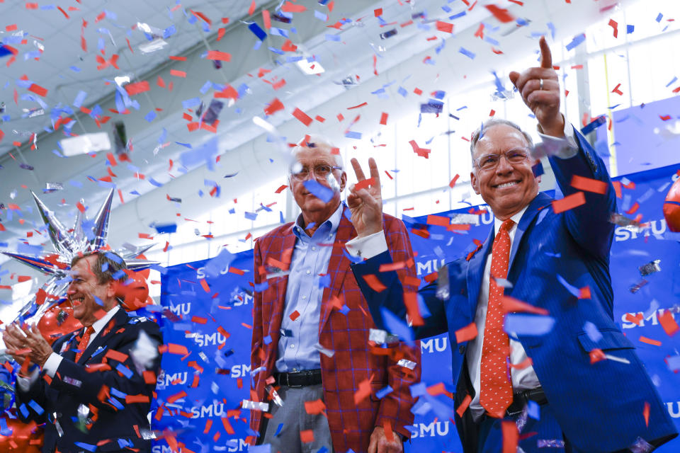 FILE - SMU President R. Gerald Turner; board chair David Miller; and Brad E. Cheves, vice president for development and external affairs, smile after the announcement of SMU's move to the Atlantic Coast Conference for NCAA college football, during a news conference Friday, Sept. 1, 2023, in Dallas. (Shafkat Anowar/The Dallas Morning News via AP, File)