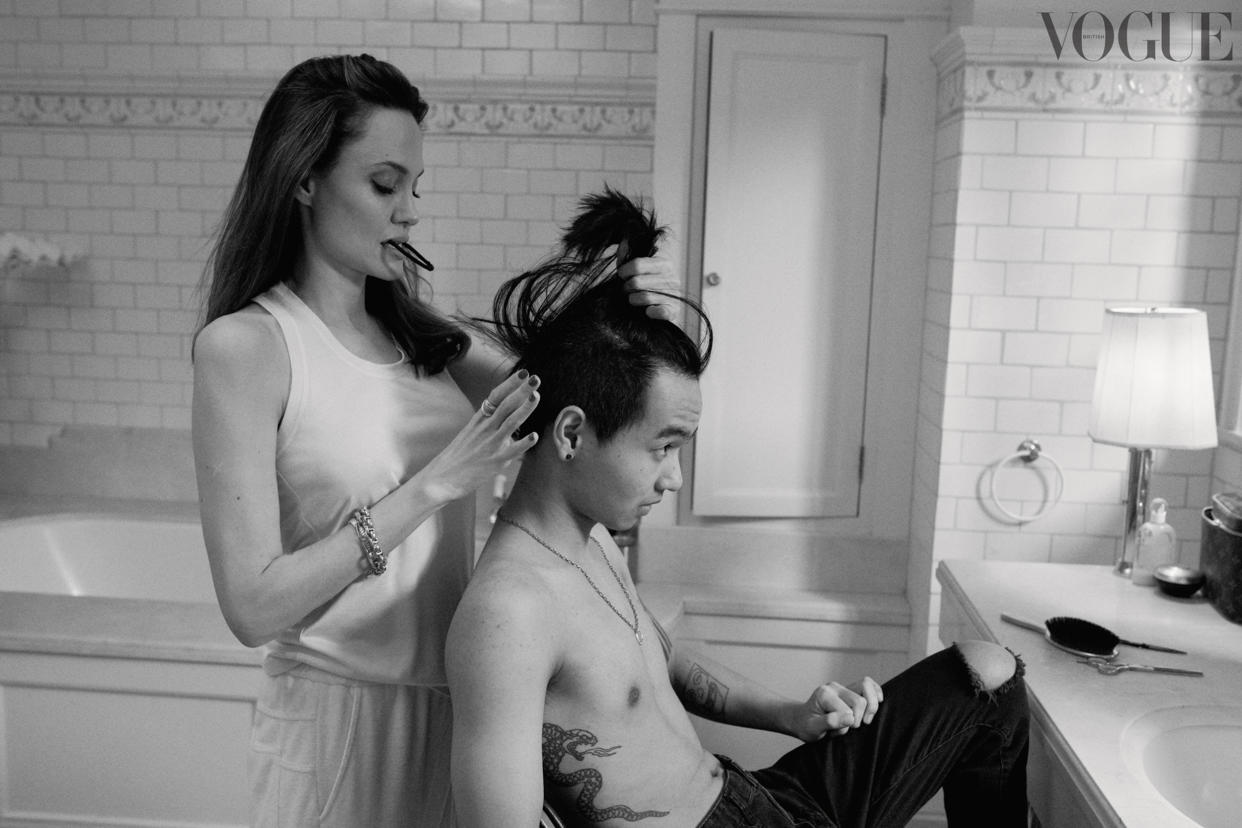 Jolie works on Maddox's hair. (Courtesy Craig McDean)