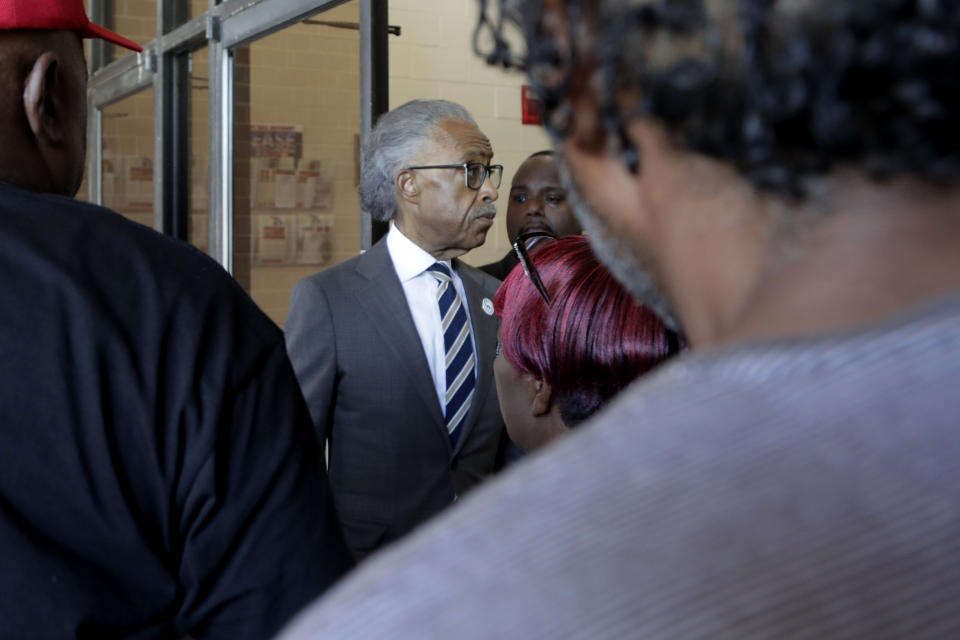 Rev. Al Sharpton, center, President of National Action Network, enters New Shiloh Baptist Church after talking to reporters, Monday, July 29, 2019, in Baltimore. After a weekend of attacks on Rep. Elijah Cummings, D-Md., the son of former sharecroppers who rose to become the powerful chairman of the House Oversight and Reform Committee, President Donal Trump expanded his attacks Monday to include Sharpton, a prominent Cummings defender, who visited Baltimore to hold a press conference in condemnation of the president. (AP Photo/Julio Cortez)