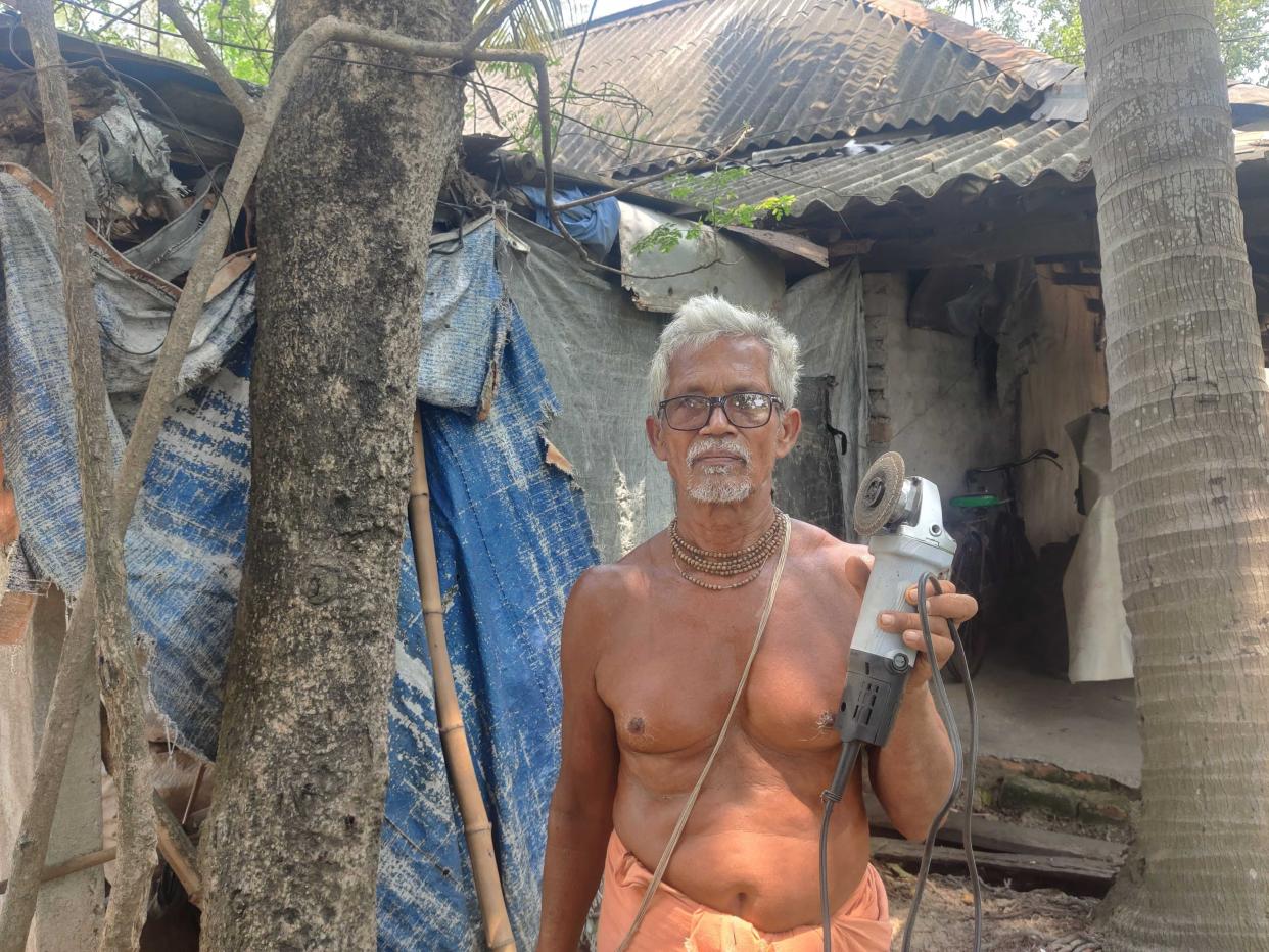 Onkar Nath Panda, who lives just 50 metres away from the train tracks where the crash took place, shows the electric cutter he used to rescued passengers (Alisha Rahaman Sarkar)