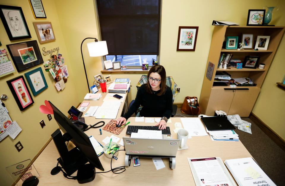 Community Foundation of the Ozarks new President and CEO Winter Kinne works in her office on Monday, Jan. 8, 2024.