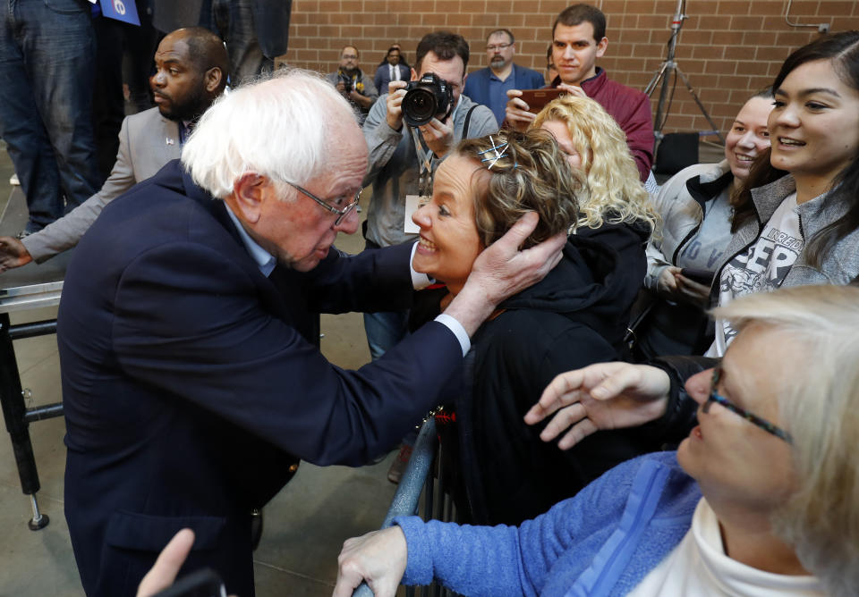 2020 Democratic presidential candidate Sen. Bernie Sanders, left, meets with Sarah Bass of Boone, after a rally, Saturday, March 9, 2019, at the Iowa state fairgrounds in Des Moines, Iowa. (AP Photo/Matthew Putney)