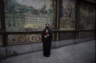 Spanish Flamenco dancer Anabel Moreno poses with a rose outside the Villa Rosa Tablao flamenco venue before a protest in Madrid, Spain, Thursday March 4, 2021. The National Association of Tablaos protested outside the mythical Villa Rosa Tablao which has been forced to close permanently due to the covid pandemic. (AP Photo/Paul White)