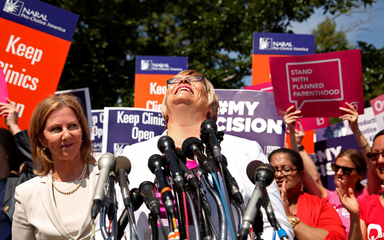 Lead plaintiff Amy Hagstrom-Miller, president and CEO of Whole Woman's Health, arrives to speak outside the U.S. Supreme Court after the court handed a victory to abortion rights advocates, striking down a Texas law imposing strict regulations on abortion doctors and facilities, June 27, 2016. At left is Nancy Northup, president and chief executive of the Center for Reproductive Rights. (Kevin Lamarque/Reuters)