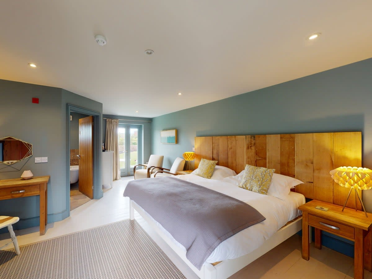 Rooms feature super-king-size beds and private patio areas (Titchwell Manor)