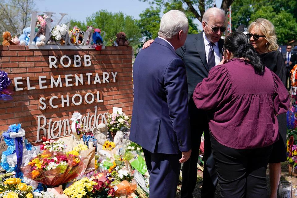 President Joe Biden and first lady Jill Biden talk with principal Mandy Gutierrez and superintendent Hal Harrell as they visit Robb Elementary School to pay their respects to the victims of the mass shooting in Uvalde, Texas.