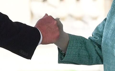 The awkward handshake - Credit: Victoria Jones/PA