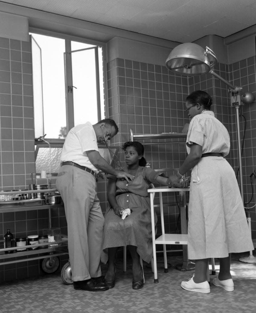 Dr. R.L. Anderson and nurse Lottie Mae Chauis examine an expectant mother at the FAMU Hospital in 1953.