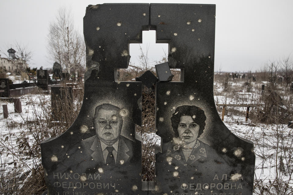 <span class="s1">A cemetery full of tombstones that have been hit by gunfire in a devastated neighborhood near the Donetsk airport. (Photograph by Paula Bronstein)</span>