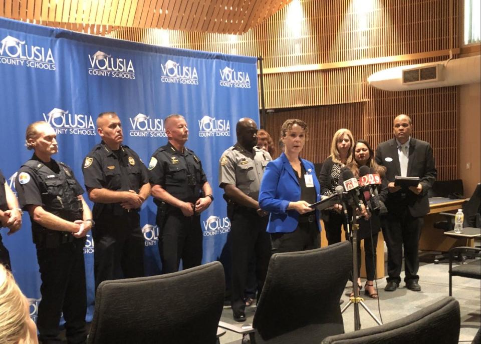 Michelle Newman, director of security and safety at Volusia County Schools, stands with police chiefs and representatives of law enforcement agencies from across the county, during a press conference on Wednesday, Aug. 10, 2022, in the DeLand board room.