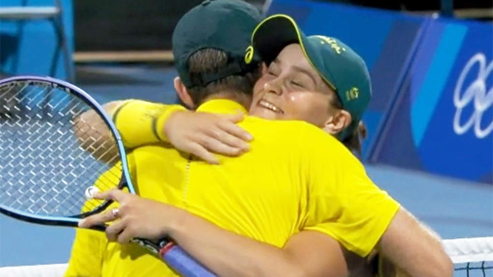 Ash Barty and John Peers (pictured) hug each other after winning in mixed doubles quarter-final.