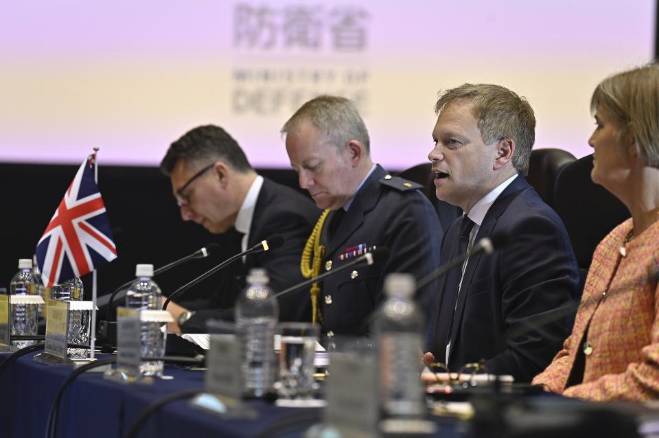 Britain's Defense Minister Grant Shapps, second right, attends a trilateral meeting with Italy's Defense Minister Guido Crosetto, not seen, and Japanese Defense Minister Minoru Kihara, not seen, at the defense ministry Thursday, Dec. 14, 2023, in Tokyo, Japan. (David Mareuil/Pool Photo via AP)