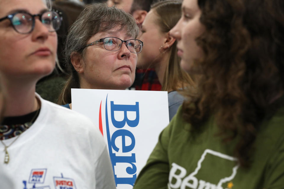 ESSEX JUNCTION, VERMONT - MARCH 03: Supporters watch as primary election results are shown on television during a Super Tuesday night rally with Democratic presidential candidate Sen. Bernie Sanders (I-VT) at the Champlain Valley Expo March 03, 2020 in Essex Junction, Vermont. 1,357 Democratic delegates are at stake as voters cast their ballots in 14 states and American Samoa on what is known as Super Tuesday. (Photo by Chip Somodevilla/Getty Images)