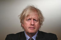 Britain's Prime Minister Boris Johnson speaks during a televised press conference at 10 Downing Street in London, Monday, Feb. 22, 2021. Johnson has announced a gradual easing of one of Europe’s strictest lockdowns, saying children will return to class and people will be able to meet a friend for coffee in a park in two weeks’ time. But people longing for a haircut, a restaurant meal or a pint in a pub have almost two months to wait, and people won’t be able to hug loved ones that they don’t live with until May at the earliest. (Leon Neal/Pool Photo via AP)