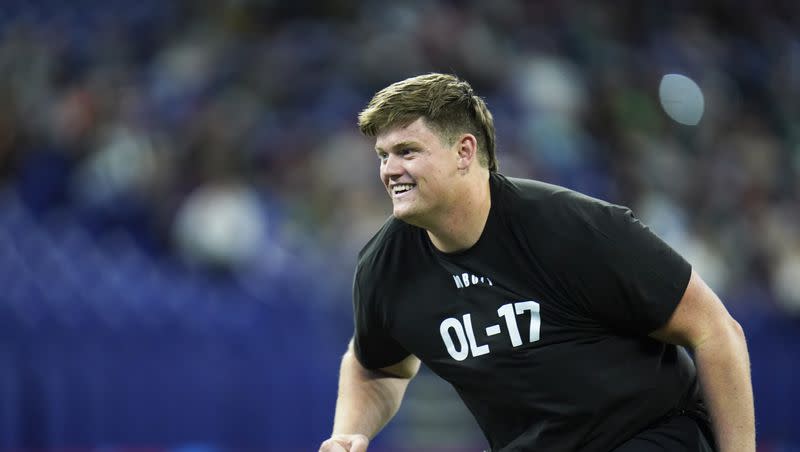 BYU offensive lineman Blake Freeland runs a drill at the NFL football scouting combine in Indianapolis, Sunday, March 5, 2023.