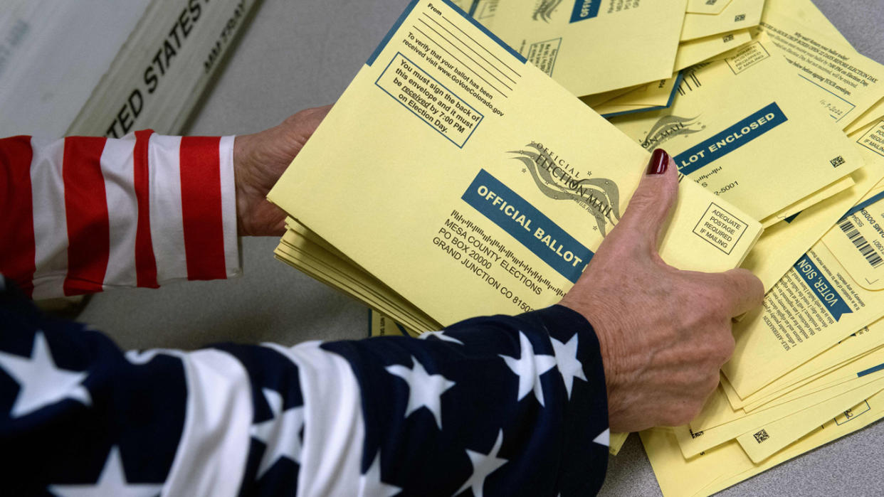 An election worker sorts ballots