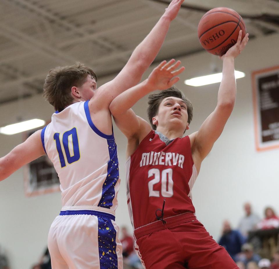 Minerva's Braxton Keister, right, puts up a shot defended by Maysville's Coen Fink during a district semifinal, Wednesday, March 6, 2024, at Claymont High School.