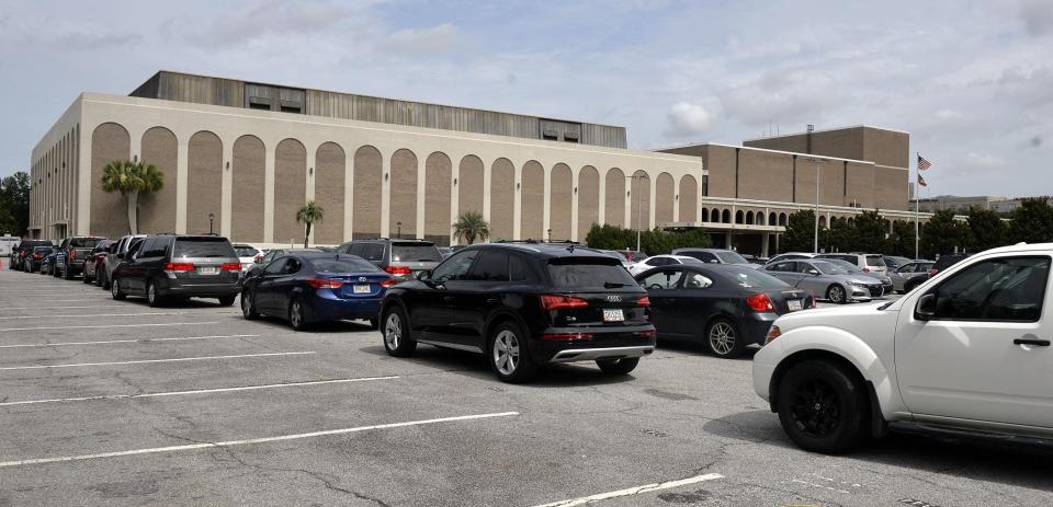 Cars line up outside the Savannah Civic Center for free testing of COVID-19 testing. On Oct. 15 flu shots will be available at this site.