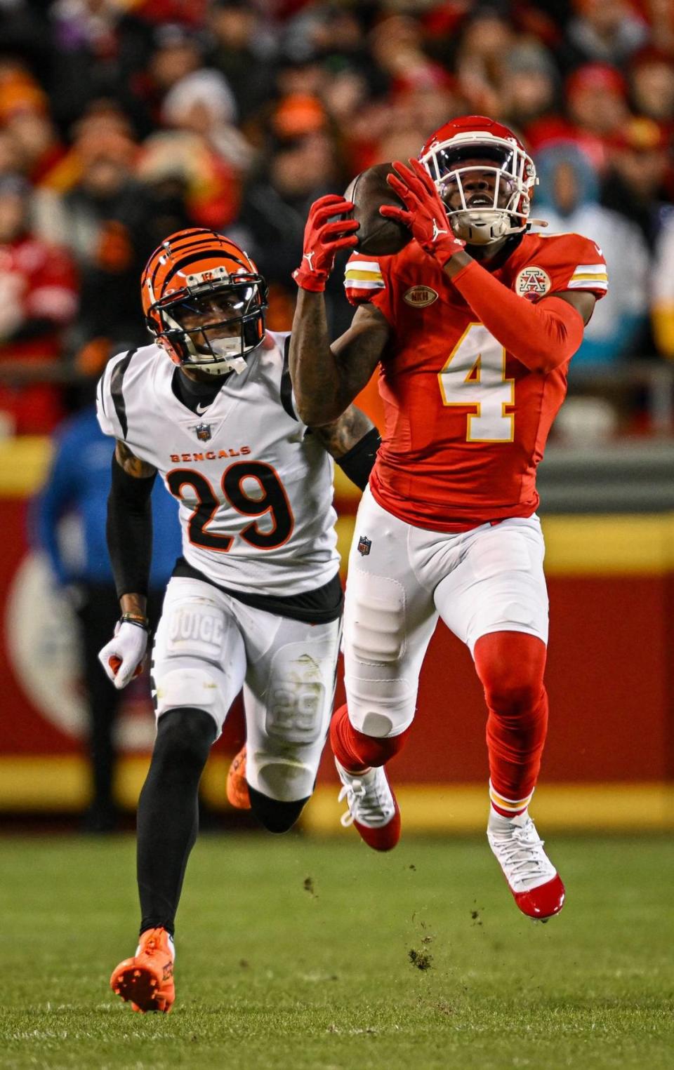 Kansas City Chiefs wide receiver Rashee Rice (4) catches a pass for a 67-yard reception in front of Cincinnati Bengals cornerback Cam Taylor-Britt (29) in the third quarter Sunday, Dec. 31, 2023, at GEHA Field at Arrowhead Stadium.