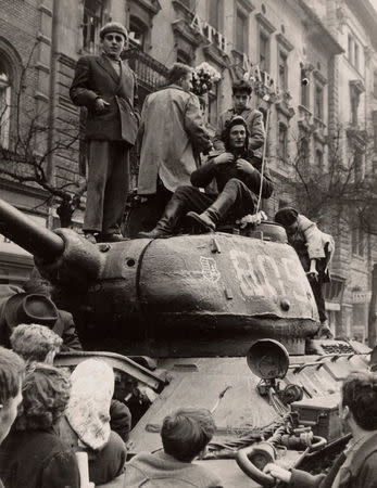 Fighters stand on top of a tank in Budapest at the time of the uprising against the Soviet-supported Hungarian communist regime in 1956. The picture was taken in the period between October 23 and November 4, 1956. REUTERS/Laszlo Almasi /File Photo