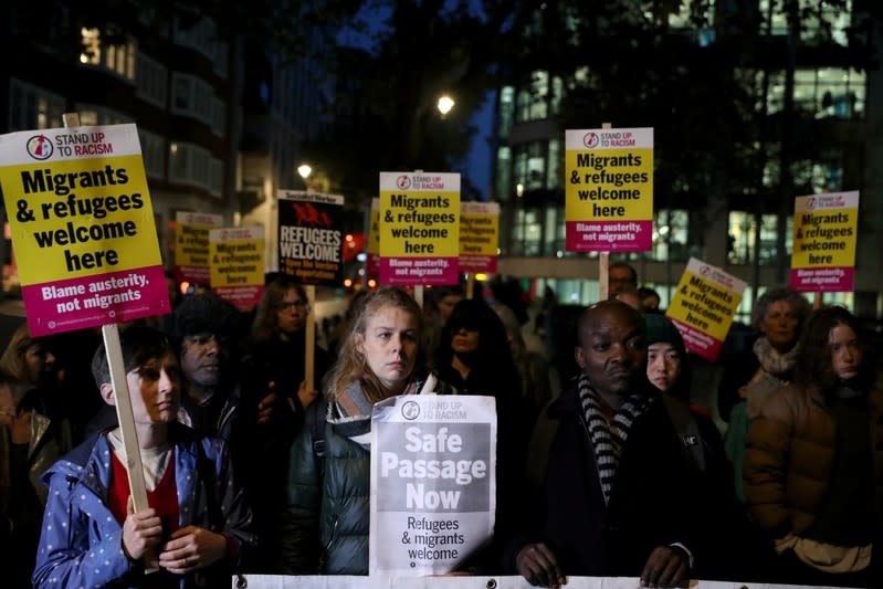 Anti-racism campaigners take part in a vigil, following the discovery of 39 bodies in a truck container, outside the Home Office in London
