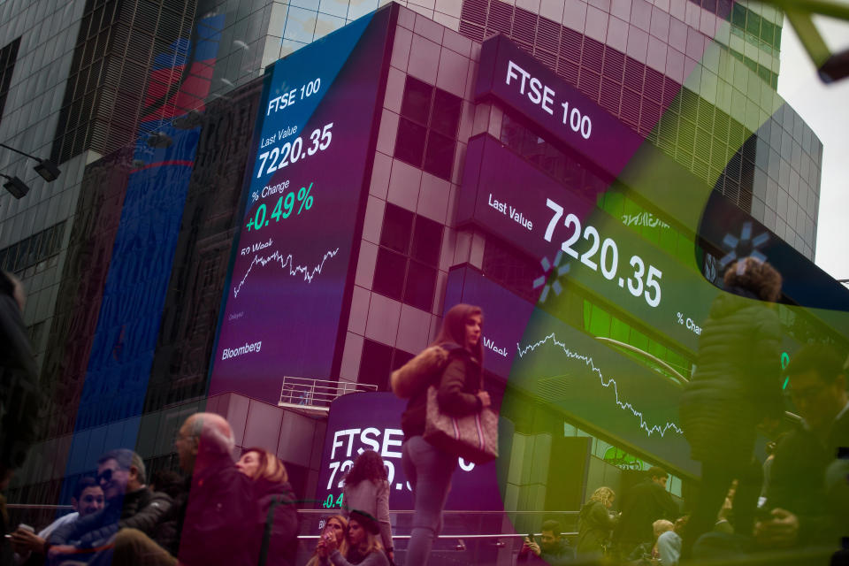 Monitors display FTSE 100 figures outside Morgan Stanley & Co. headquarters in the Times Square. Photo: Michael Nagle/Bloomberg/Getty