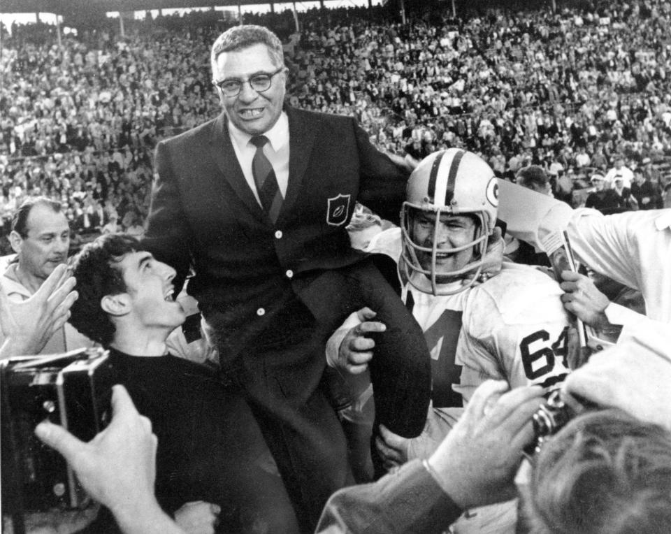 Green Bay coach Vince Lombardi is carried off the field after the Packers beat Oakland 33-14 in Super Bowl II on Jan. 14, 1968. Packers guard Jerry Kramer is at right.