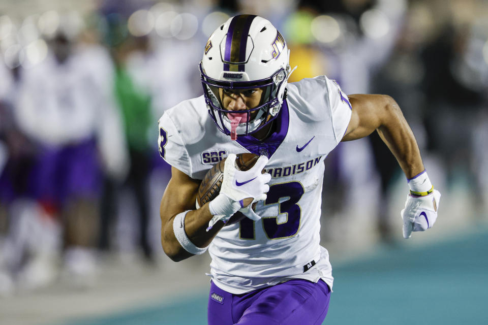 James Madison wide receiver Elijah Sarratt (13) runs for a touchdown after a catch against Coastal Carolina during the second half of an NCAA college football game in Conway, N.C., Saturday, Nov. 25, 2023. (AP Photo/Nell Redmond)