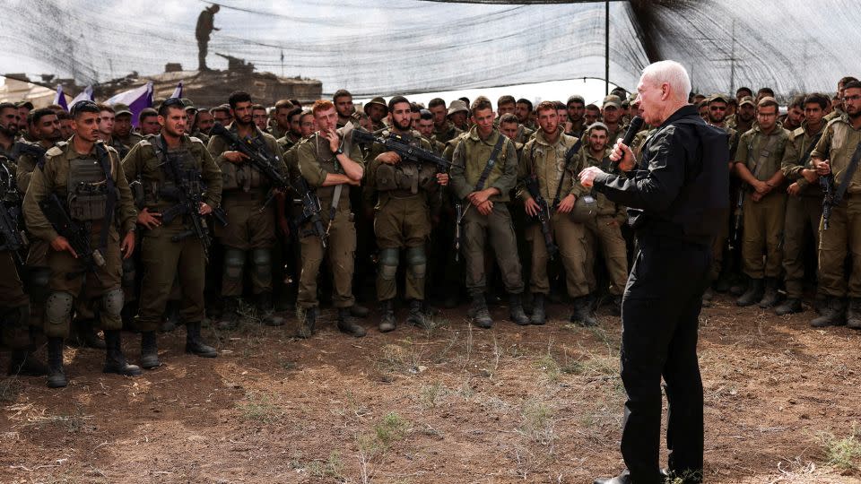 Israel's Defence Minister Yoav Gallant meets soldiers in a field near Israel's border with the Gaza Strip, in southern Israel October 19. - Ronen Zvulun/Reuters