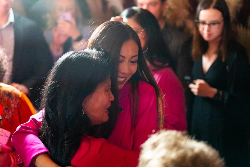 Lily Wu hugs her mother Anna after speaking to a large crowd of supporters at Doma. Wu defeated Mayor Brandon Whipple and is the second woman to win a citywide election for mayor