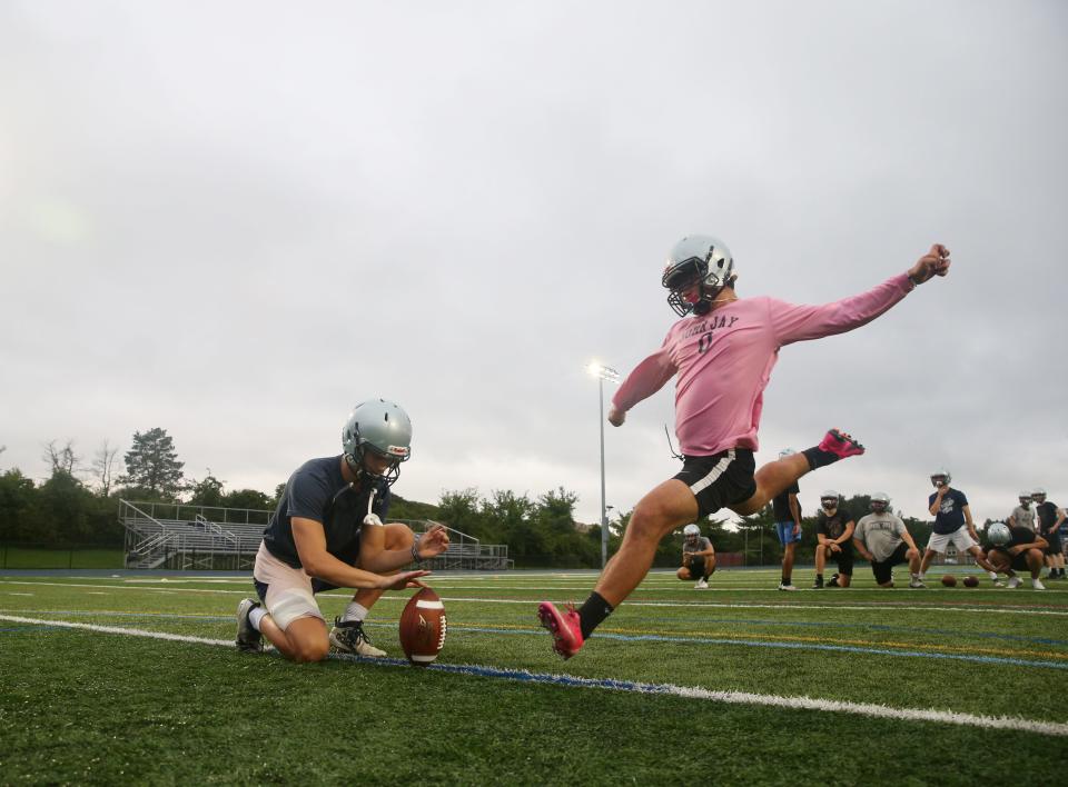 John Jay's Joey Naso practices an extra kick with holder, Conor Stroh, during Monday's football training camp on August 23, 2021. 