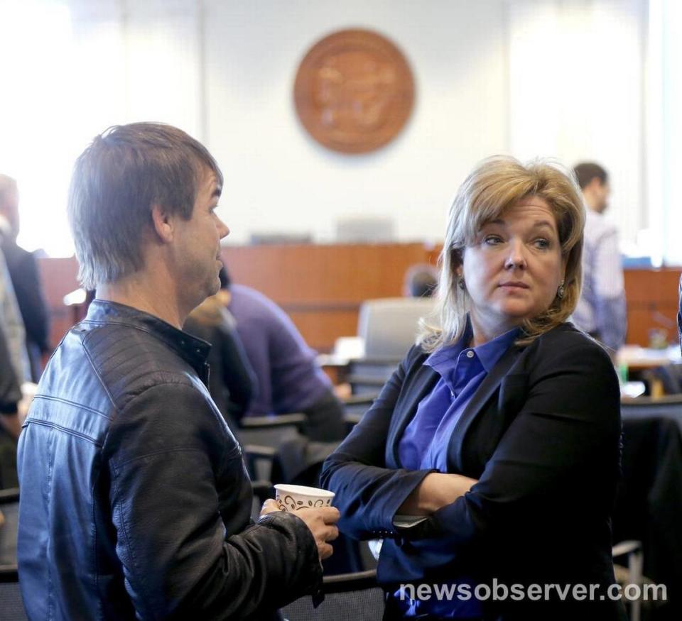 Lawyer Christine Mumma, right, with the N.C. Center for Actual Innocence talks with Dwayne Dail during a break at the N.C. State Bar in Raleigh, NC where she is having a disciplinary hearing on Monday, Jan. 11, 2015. Dail was exonerated of rape charges largely due to the work of Mumma’s commission.