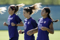 U.S. national team player Sophie Smith, right, runs with teammates during practice for a match against Nigeria Tuesday, Aug. 30, 2022, in Riverside, Mo. Women’s soccer in the United States has struggled with diversity, starting with a pay-to-play model that can exclude talented kids from communities of color. (AP Photo/Charlie Riedel)