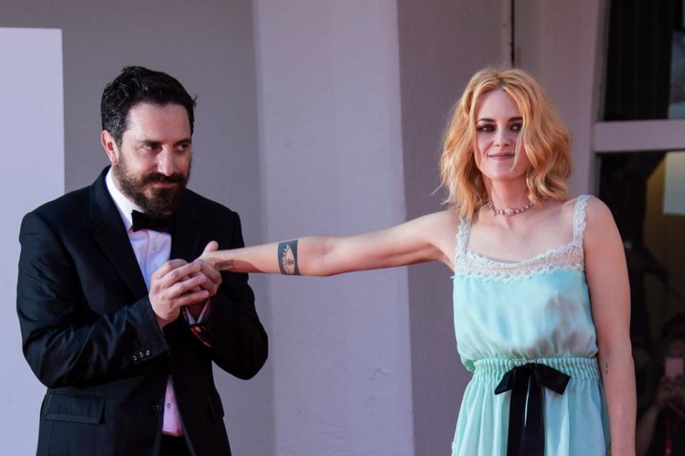 Kristen Stewart and Pablo Larrain pose for photographers upon arrival at the premiere of the film ‘Spencer’ (Joel C Ryan/Invision/AP)