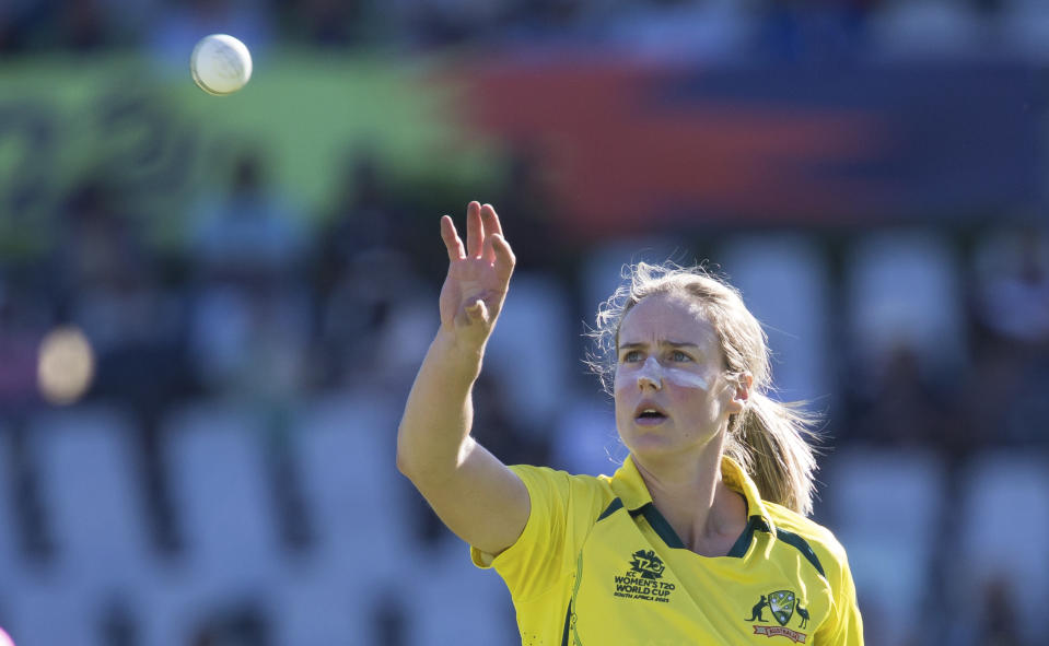 Australia's Ellyse Perry receives the ball before bowling against India during the Women's T20 World Cup semi final cricket match in Cape Town, South Africa, Thursday Feb. 23, 2023. (AP Photo/Halden Krog)