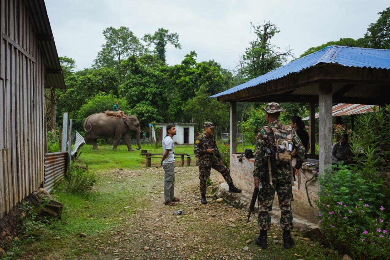 Members of the Nepali army brief each other before going on patrol