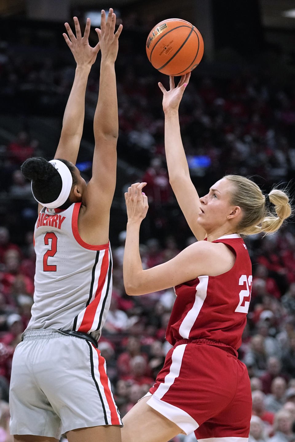 Nebraska forward Natalie Potts (22) shoots against Ohio State guard Taylor Thierry (2) during the first half of an NCAA college basketball game Wednesday, Feb. 14, 2024, in Columbus, Ohio. (AP Photo/Sue Ogrocki)