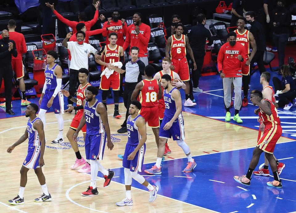 Hawks center Clint Capela (far right) and teammates begin to celebrate after Philadelphia 76ers center Joel Embiid misses both his free throw attempts with 10.9 seconds left in Game 5. Atlanta rallied from 26 points down to take a 3-2 series lead.
