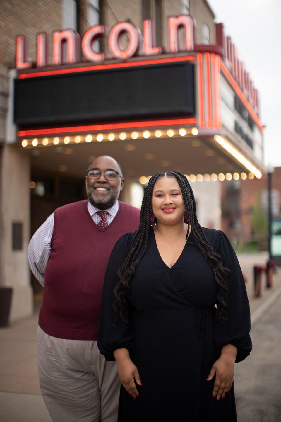 Milton Ruffin, choral director of the Milton Ruffin Gospel Chorale, and Destiny Coleman, Converging Arts Columbus board member, pose in front of the Lincoln Theatre.