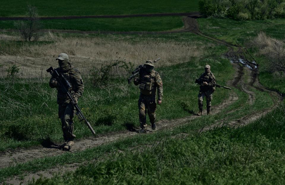 Ukrainian army snipers change their position facing Russian troops near Bakhmut, Donetsk region, Ukraine, Tuesday, May 2, 2023.