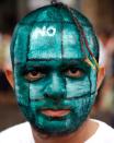 Student Mihir Joshi, with a painted face depicting a hand grenade, participates in a peace rally in Mumbai August 6, 2011, to mark the 66th anniversary of the world's first atomic attack on Hiroshima, Japan. REUTERS/Danish Siddiqui