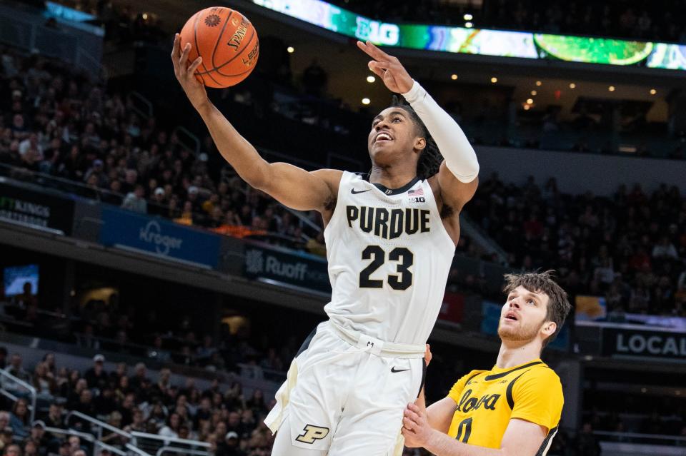 Mar 13, 2022; Indianapolis, IN, USA; Purdue Boilermakers guard Jaden Ivey (23) shoots the ball while Iowa Hawkeyes forward Filip Rebraca (0) defends  in the first half at Gainbridge Fieldhouse. Mandatory Credit: Trevor Ruszkowski-USA TODAY Sports