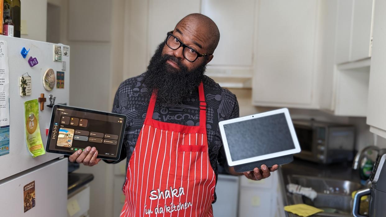  Tshaka holding up a Pixel Tablet and Nest Hub Max 