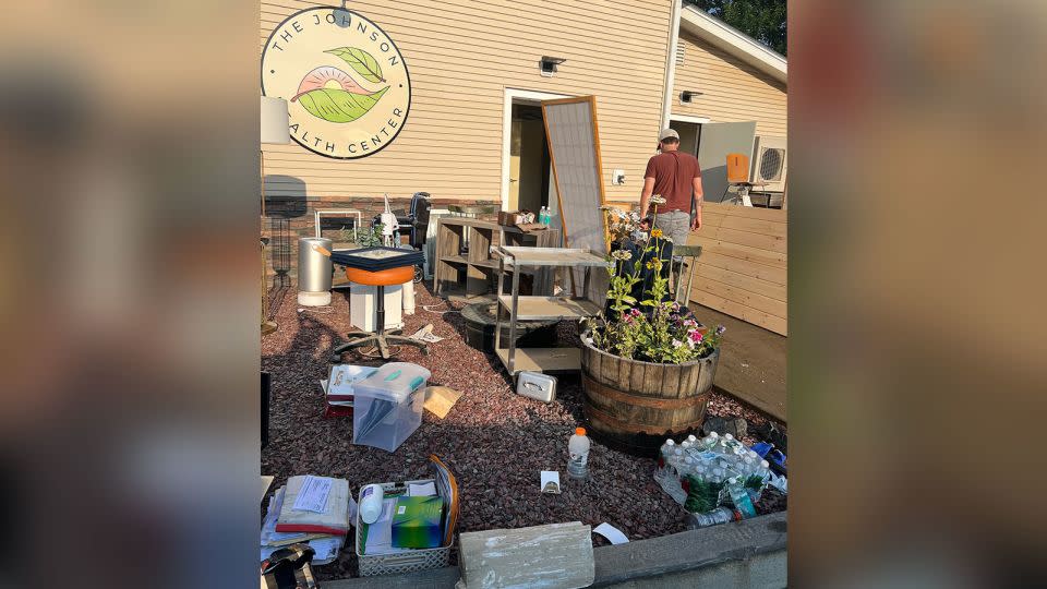 Caroline and Geoff Butler, along with friends and patients, cleaned out debris from the clinic and dried out the building. - Courtesy Caroline and Geoffrey Butler